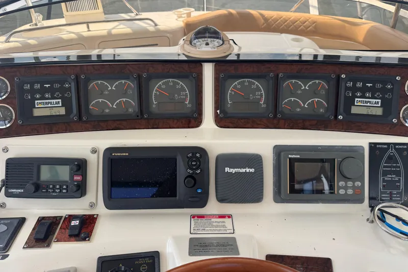Slide: The Image of Control panel of a 2004 Regal Commodore 3260 boat with navigation instruments. - 24