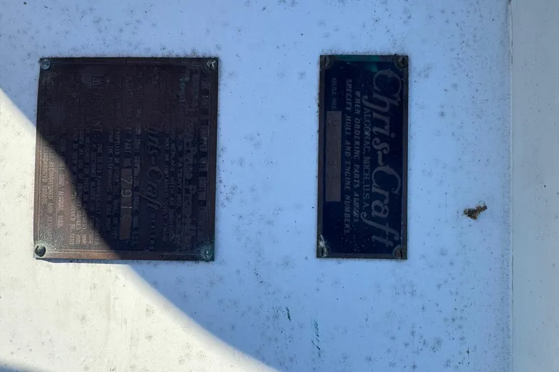 Slide: The Image of 1940 Chris-Craft Launch 25 identification plates on a weathered surface. - 15