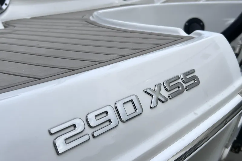 Slide: The Image of 2022 Crownline 290 XSS boat, close-up of model name on deck. - 13