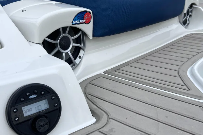 Slide: The Image of 2022 Crownline 290 XSS boat deck with speakers and control panel. - 14