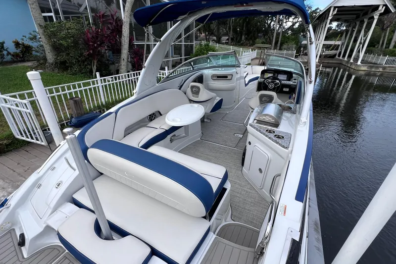 Slide: The Image of 2022 Crownline 290 XSS boat interior with luxurious seating and modern amenities. - 16
