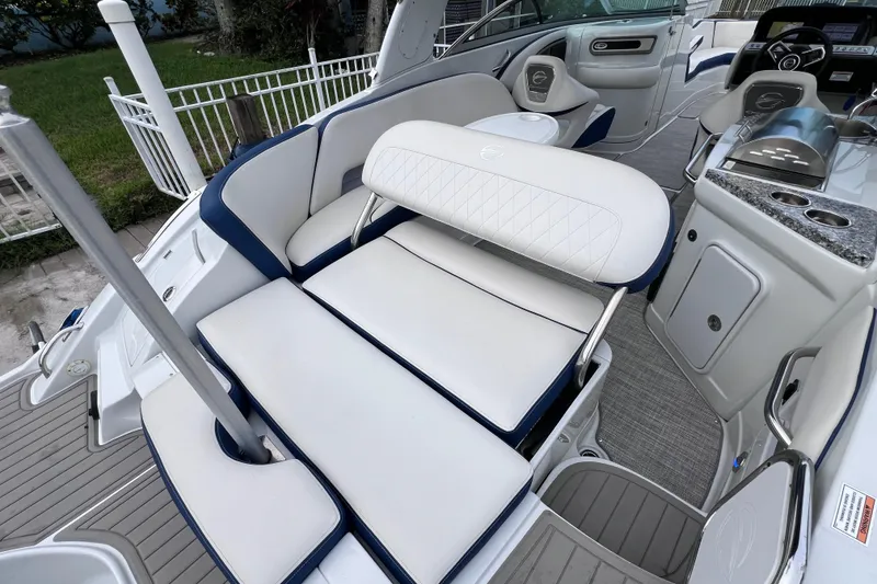 Slide: The Image of 2022 Crownline 290 XSS boat interior with luxurious seating and modern amenities. - 23