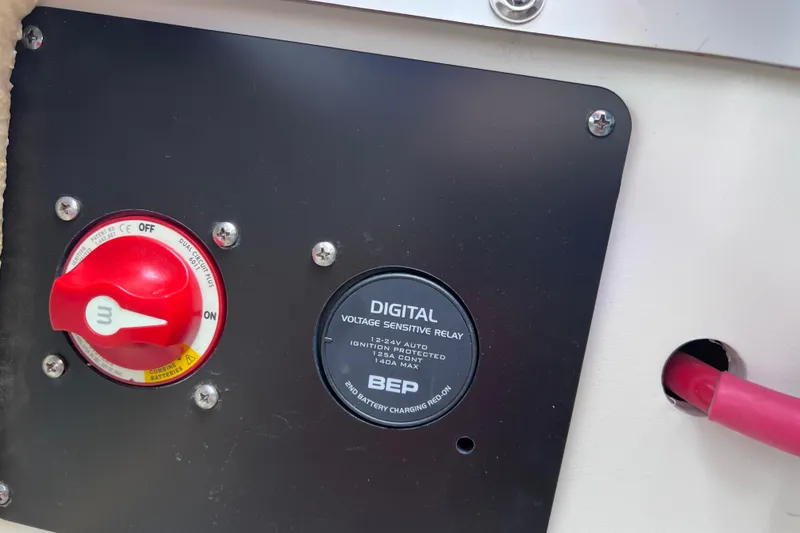 Slide: The Image of Crownline 290 XSS 2022 boat battery switch and digital voltage relay panel. - 29