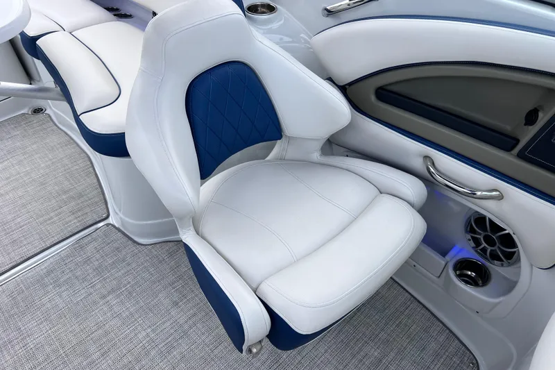 Slide: The Image of Luxury seating in 2022 Crownline 290 XSS boat, featuring white and blue upholstery. - 36