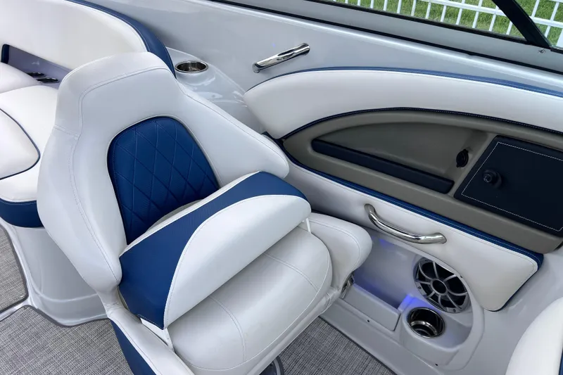 Slide: The Image of Luxurious interior of 2022 Crownline 290 XSS boat with blue and white seating. - 37
