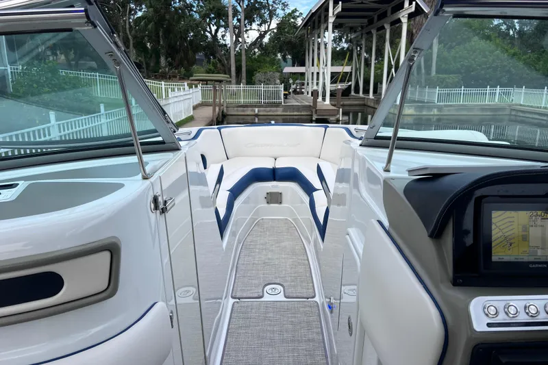 Slide: The Image of 2022 Crownline 290 XSS boat interior with seating and navigation display. - 41