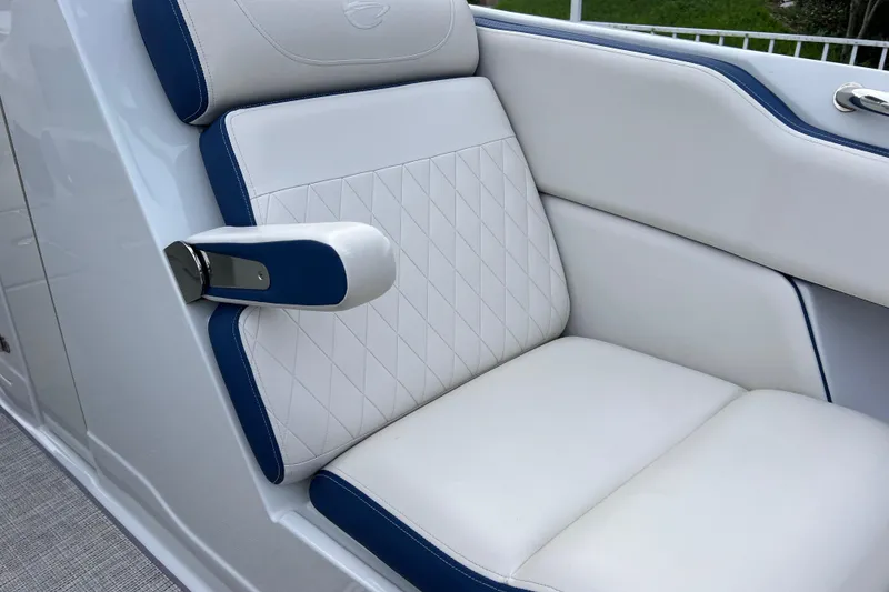 Slide: The Image of 2022 Crownline 290 XSS boat seat with white and blue upholstery, diamond stitching. - 43