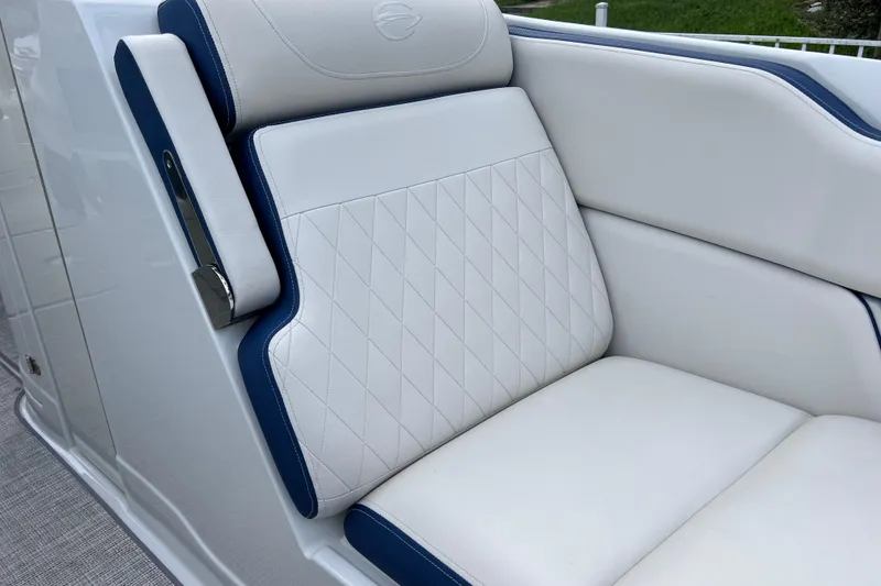 Slide: The Image of 2022 Crownline 290 XSS boat seat with white and blue upholstery, diamond stitching. - 44