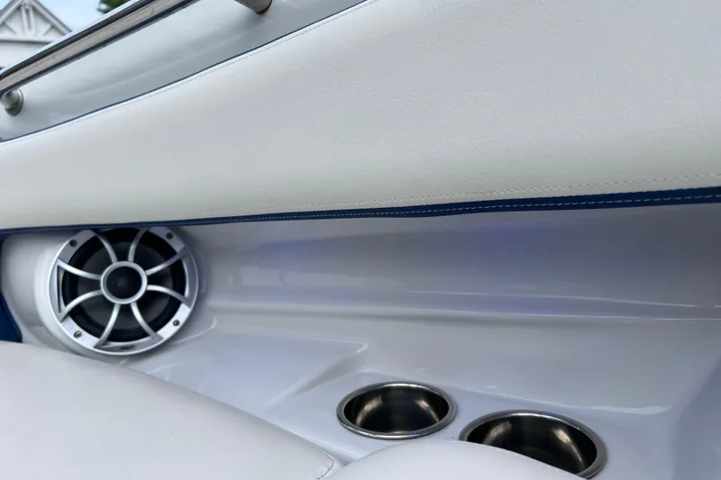 Slide: The Image of 2022 Crownline 290 XSS boat interior with speaker and cup holders. - 48