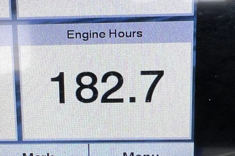 Slide: The Image of Crownline 290 XSS 2022 engine hours display showing 182.7 hours. - 56