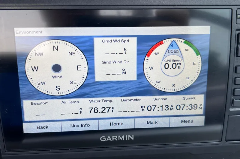 Slide: The Image of Garmin display on 2022 Crownline 290 XSS showing wind, temperature, and GPS data. - 57