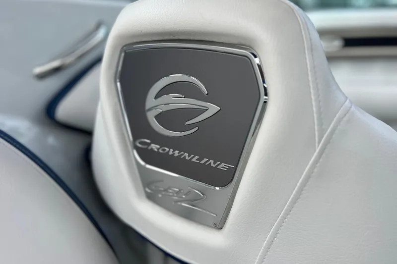 Slide: The Image of 2022 Crownline 290 XSS boat seat with logo detail in sleek design. - 64
