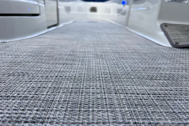 Slide: The Image of 2022 Crownline 290 XSS boat interior with textured flooring detail. - 65