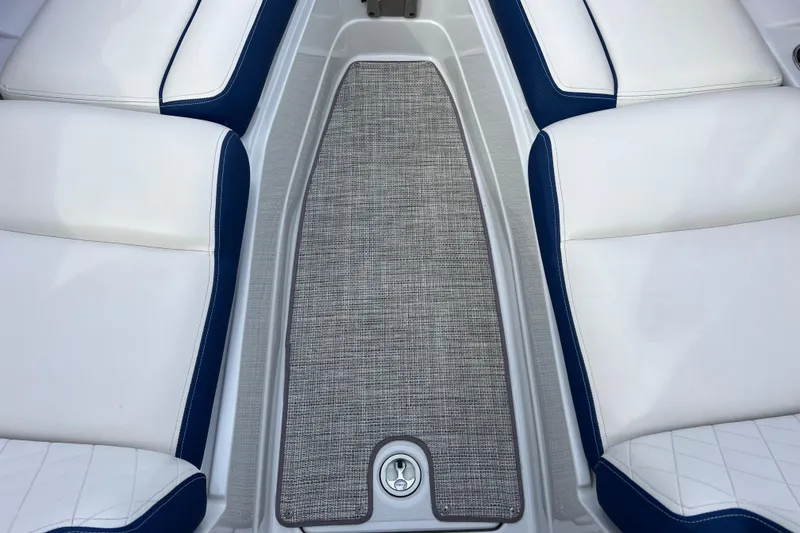 Slide: The Image of Interior of 2022 Crownline 290 XSS boat with white and blue seating. - 68
