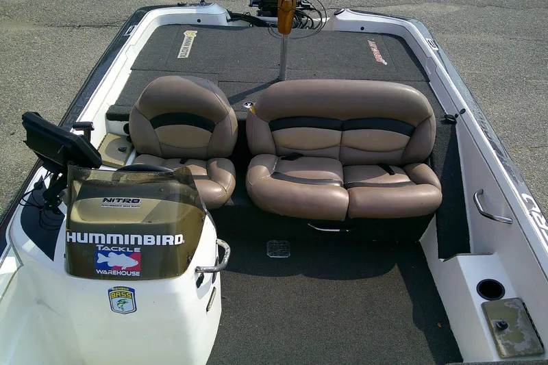 Slide: The Image of 1997 Nitro Savage 896 boat interior with dual seats and Humminbird equipment. - 10