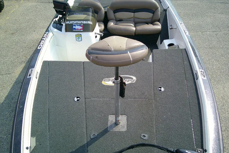 Slide: The Image of 1997 Nitro Savage 896 boat interior with seating and fishing deck. - 11