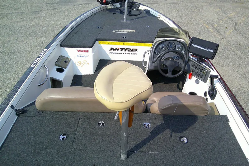 Slide: The Image of 1997 Nitro Savage 896 boat interior with steering console and seating. - 8