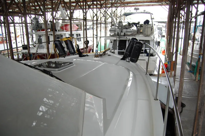 Slide: The Image of Ocean Alexander 520 Pilothouse yacht docked in a marina, 1990 model. - 18