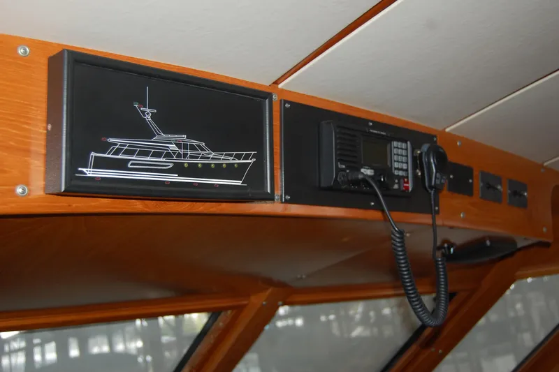 Slide: The Image of Interior view of 1990 Ocean Alexander 520 Pilothouse with communication equipment. - 28