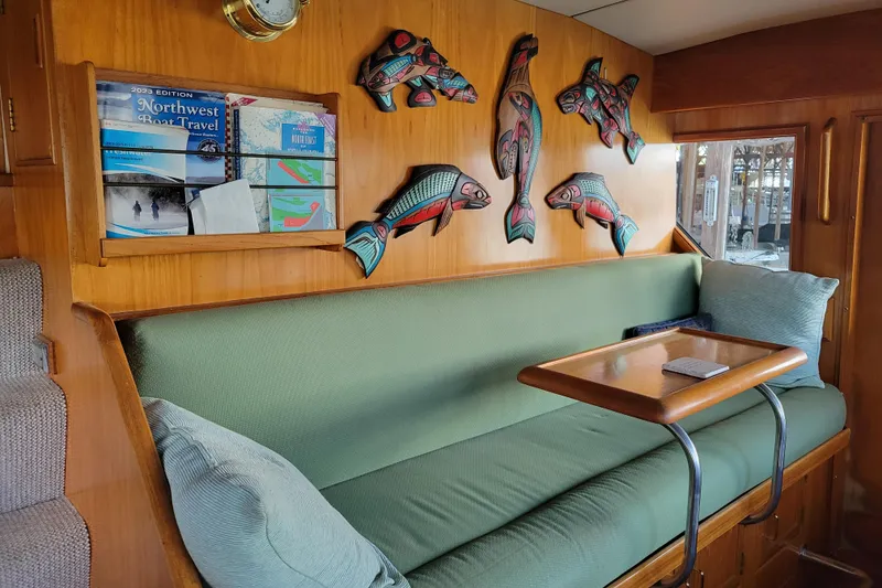 Slide: The Image of Interior of 1990 Ocean Alexander 520 Pilothouse with fish decor and green seating. - 30
