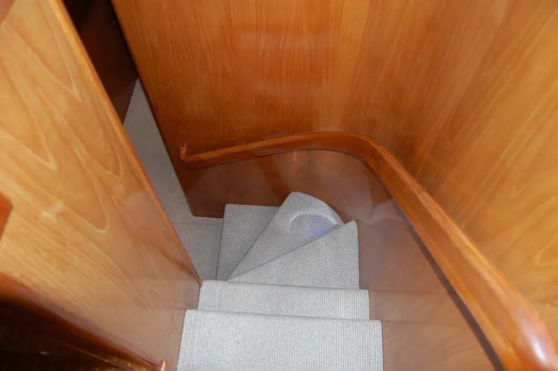 Slide: The Image of Staircase with wooden paneling on 1990 Ocean Alexander 520 Pilothouse yacht. - 32