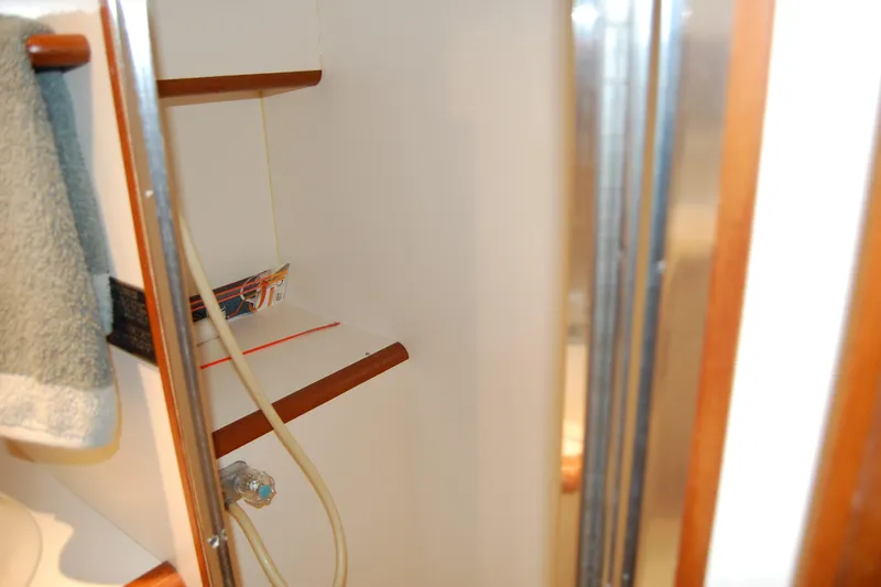 Slide: The Image of Interior of 1990 Ocean Alexander 520 Pilothouse, featuring shelves and a towel. - 34