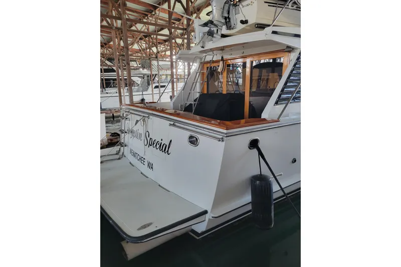 Slide: The Image of 1990 Ocean Alexander 520 Pilothouse yacht docked in a marina. - 4