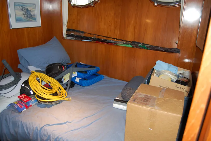 Slide: The Image of Cozy cabin interior of 1990 Ocean Alexander 520 Pilothouse with storage items. - 42