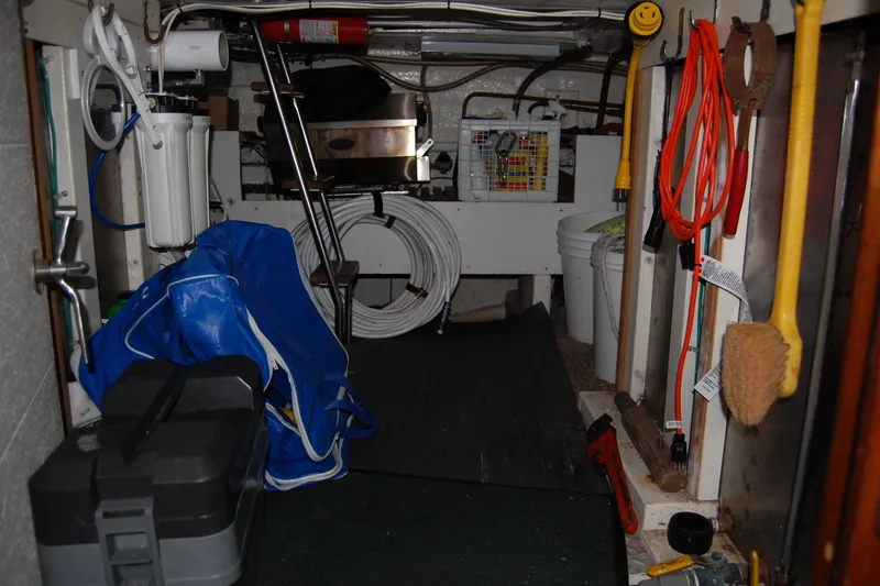 Slide: The Image of Storage area of 1990 Ocean Alexander 520 Pilothouse with tools and equipment. - 47