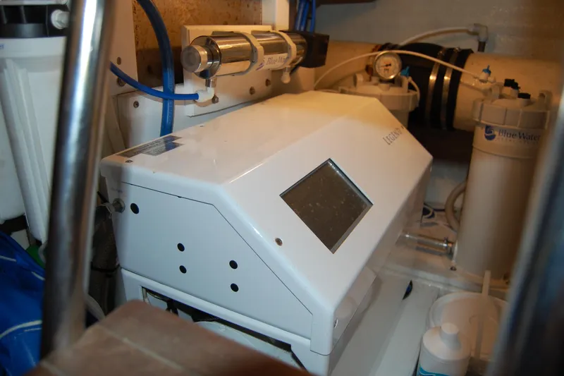 Slide: The Image of Engine room of 1990 Ocean Alexander 520 Pilothouse with water filtration system. - 48