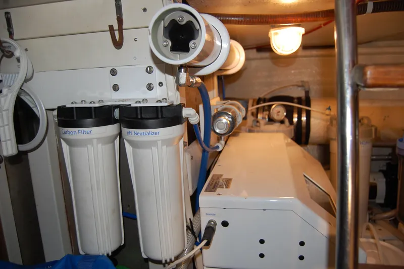 Slide: The Image of Engine room of 1990 Ocean Alexander 520 Pilothouse with water filtration system. - 49