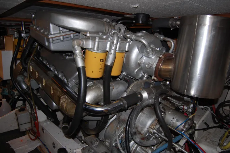 Slide: The Image of Engine room of 1990 Ocean Alexander 520 Pilothouse yacht, featuring CAT components. - 51