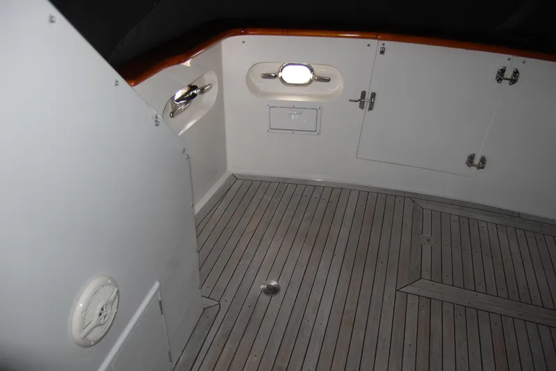 Slide: The Image of 1990 Ocean Alexander 520 Pilothouse interior with wooden flooring and white paneling. - 57