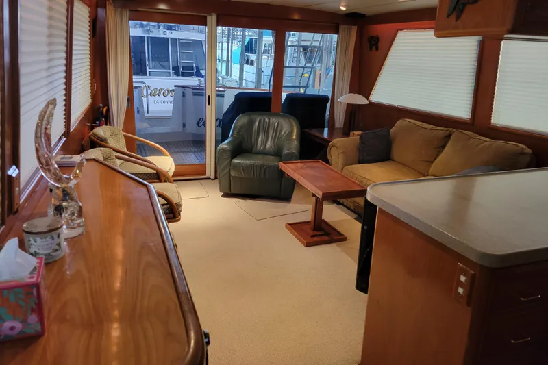 Slide: The Image of Luxurious interior of 1990 Ocean Alexander 520 Pilothouse yacht with cozy seating area. - 58