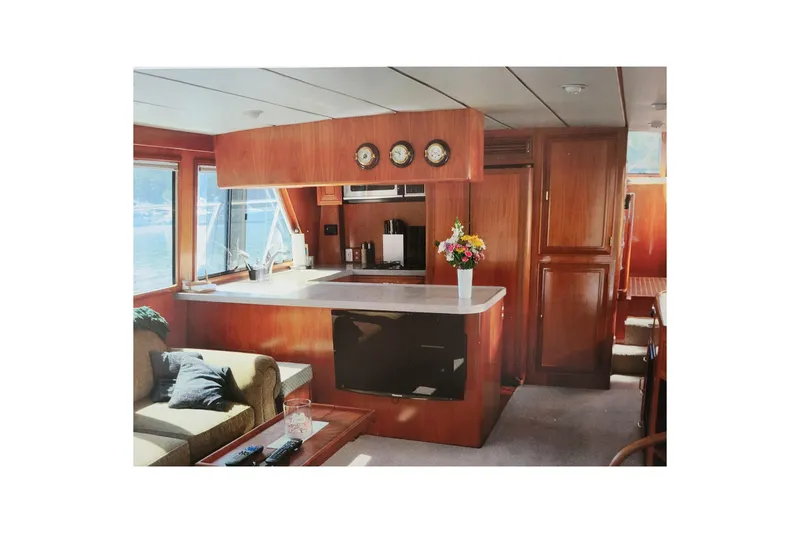Slide: The Image of Luxurious interior of 1990 Ocean Alexander 520 Pilothouse yacht with elegant wood finishes. - 59