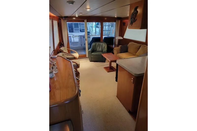 Slide: The Image of Luxurious interior of 1990 Ocean Alexander 520 Pilothouse yacht with cozy seating and elegant decor. - 65
