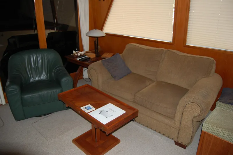 Slide: The Image of Cozy interior of 1990 Ocean Alexander 520 Pilothouse with sofa and armchair. - 70