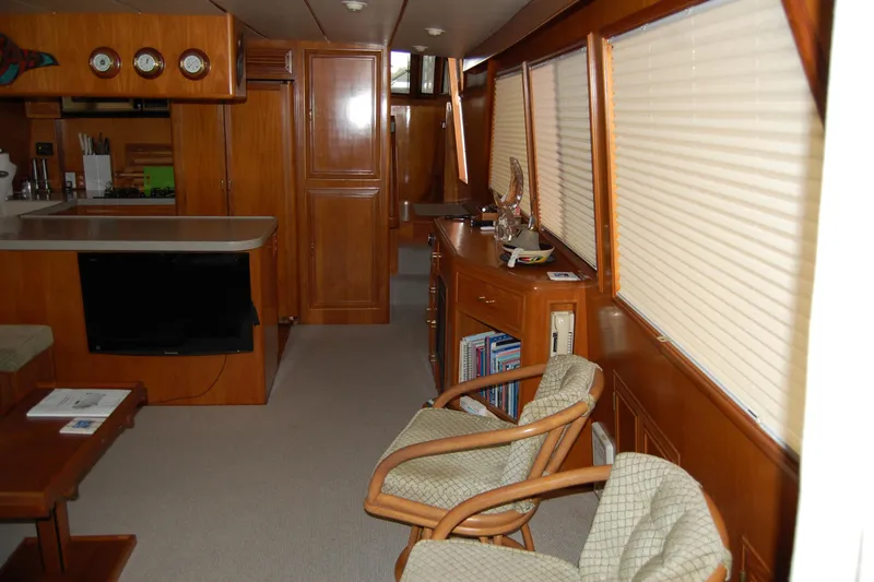 Slide: The Image of Interior of 1990 Ocean Alexander 520 Pilothouse with wood paneling and cozy seating area. - 71