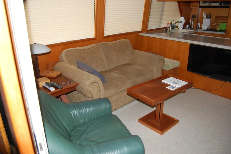 Slide: The Image of Interior of 1990 Ocean Alexander 520 Pilothouse with cozy seating and wooden accents. - 72