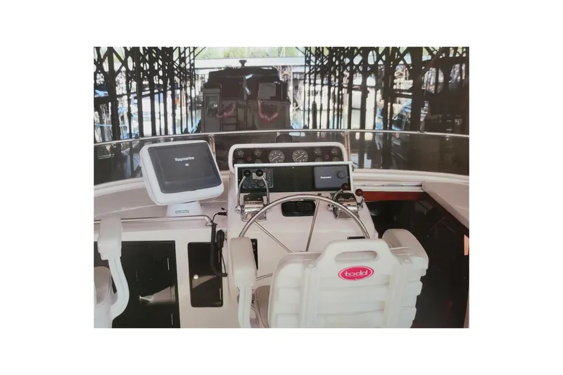 Slide: The Image of Cockpit of 1990 Ocean Alexander 520 Pilothouse with navigation equipment and steering wheel. - 75