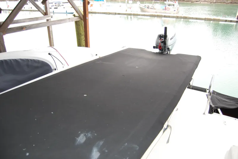 Slide: The Image of 1990 Ocean Alexander 520 Pilothouse with covered deck and outboard motor at marina. - 77