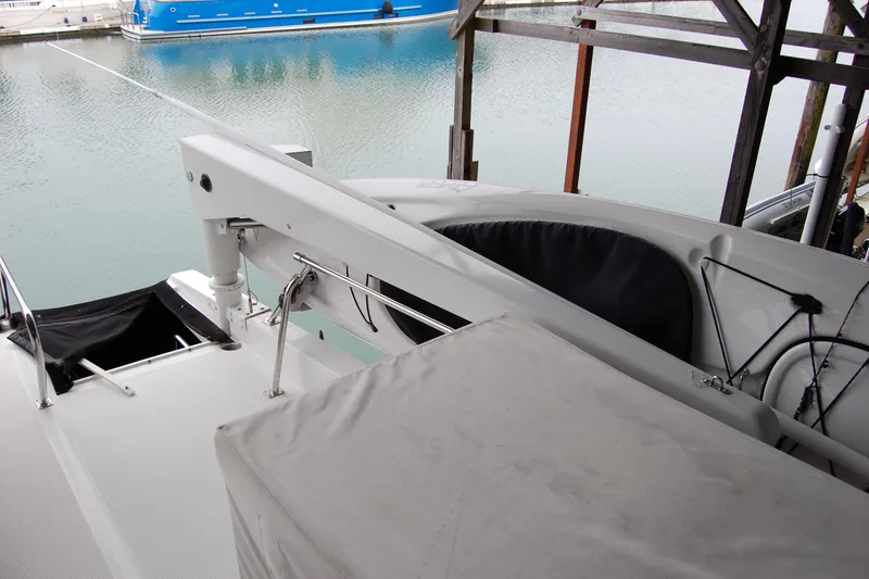 Slide: The Image of 1990 Ocean Alexander 520 Pilothouse yacht docked, featuring deck and equipment details. - 78