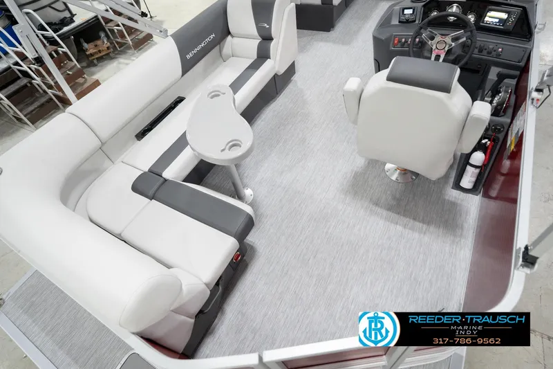 Slide: The Image of 2026 Bennington 20 SL boat interior with seating and helm, featuring modern design and controls. - 14