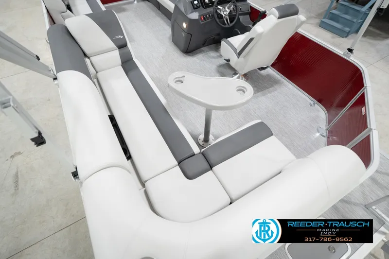 Slide: The Image of 2026 Bennington 20 SL pontoon boat interior with plush seating and modern helm. - 15