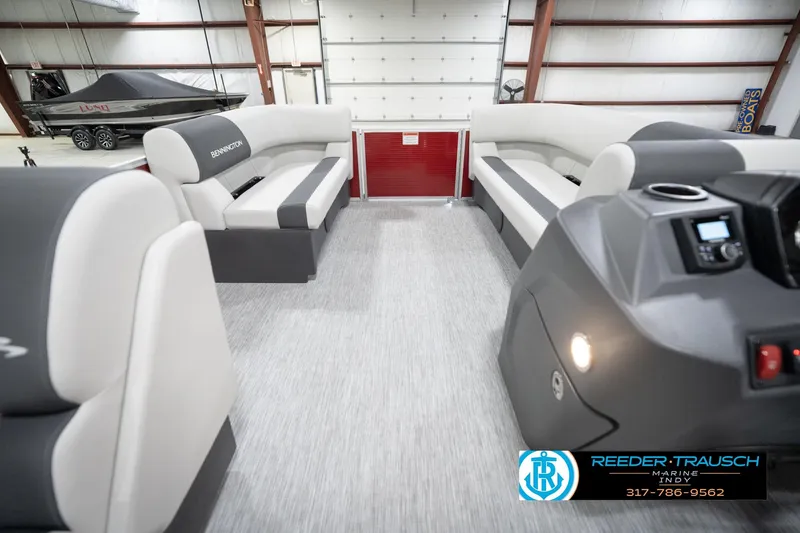 Slide: The Image of 2026 Bennington 20 SL pontoon boat interior with modern seating and control panel. - 20