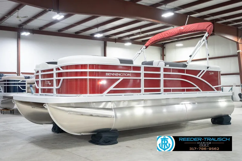 Slide: The Image of 2026 Bennington 20 SL pontoon boat with red exterior in a showroom. - 3