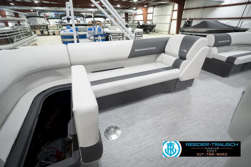 Slide: The Image of 2026 Bennington 20 SL pontoon boat interior with gray seating in showroom. - 30