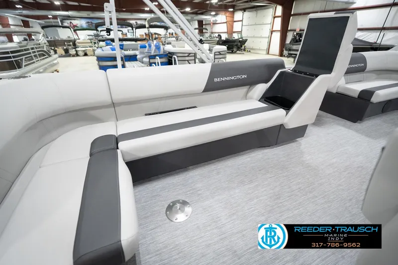 Slide: The Image of 2026 Bennington 20 SL pontoon boat interior with gray seating in showroom. - 32