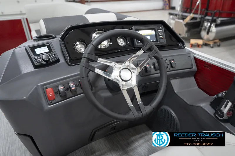 Slide: The Image of 2026 Bennington 20 SL boat dashboard with steering wheel and control panel. - 34