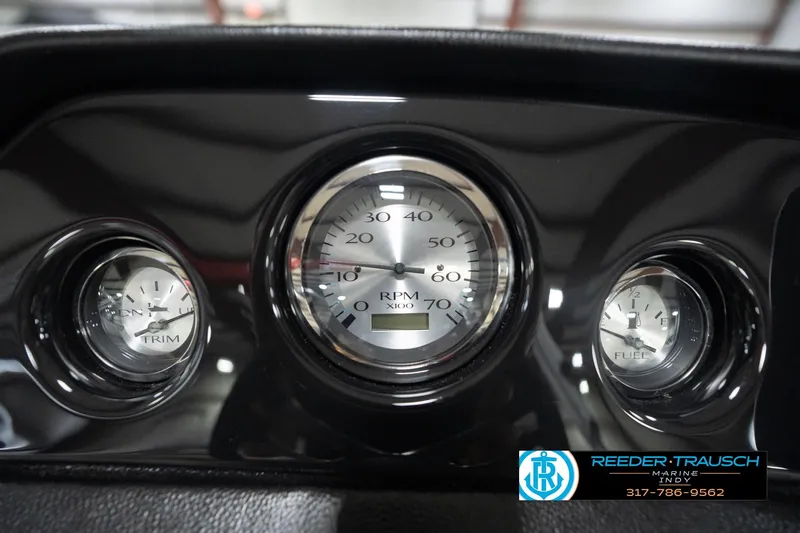Slide: The Image of Dashboard gauges of 2026 Bennington 20 SL boat, featuring RPM, trim, and fuel indicators. - 38